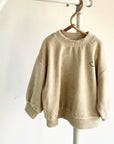 Veloure Smiley Sweater – Kuschelkomfort trifft lässigen Style