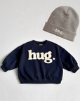 Hug Beanie – Feine Strickmütze mit Stickerei
