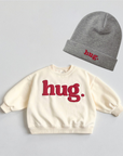 Hug Beanie – Feine Strickmütze mit Stickerei